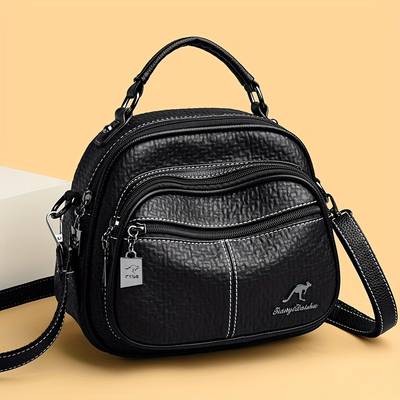 OGEHUAFEE Womens Elegant Mini Backpack Premium PU Crossbody/Backpack Hybrid with Kangaroo Logo & Tassel Accents