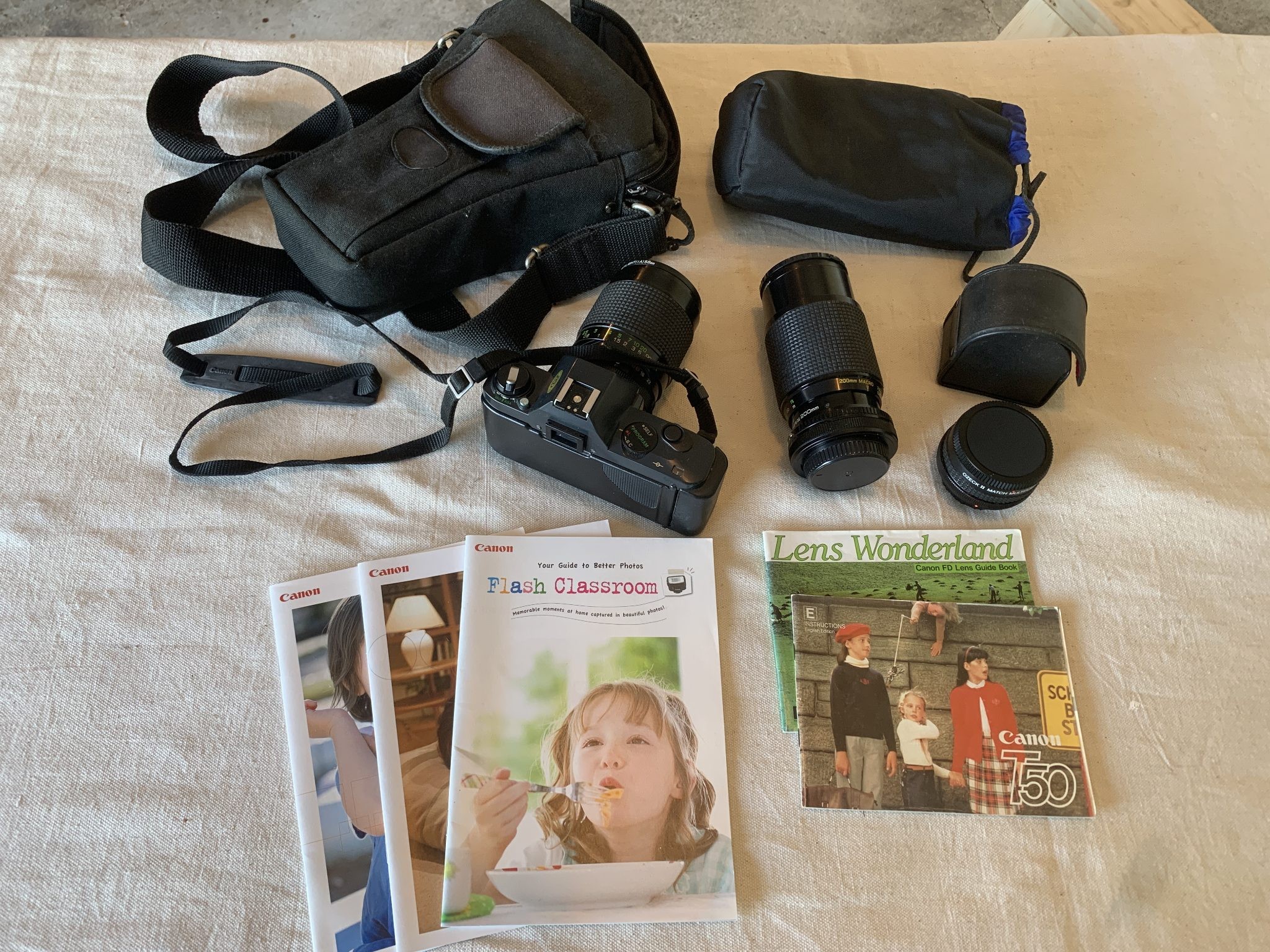 Canon T50 SLR Camera with additional lenses and OEM manuals