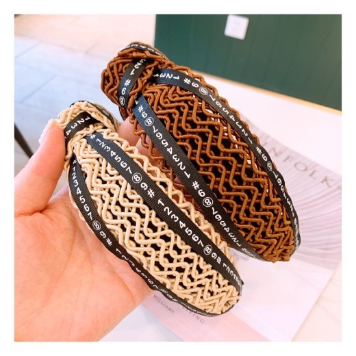 Handmade twisted letter ribbon with knotted headband in the middle